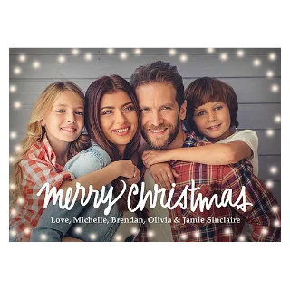 Christmas Cards: A holiday photo card of a family of four framed by string lights with the text merry christmas and Love, Michelle, Brendan, Olivia & Jamie Sinclaire.