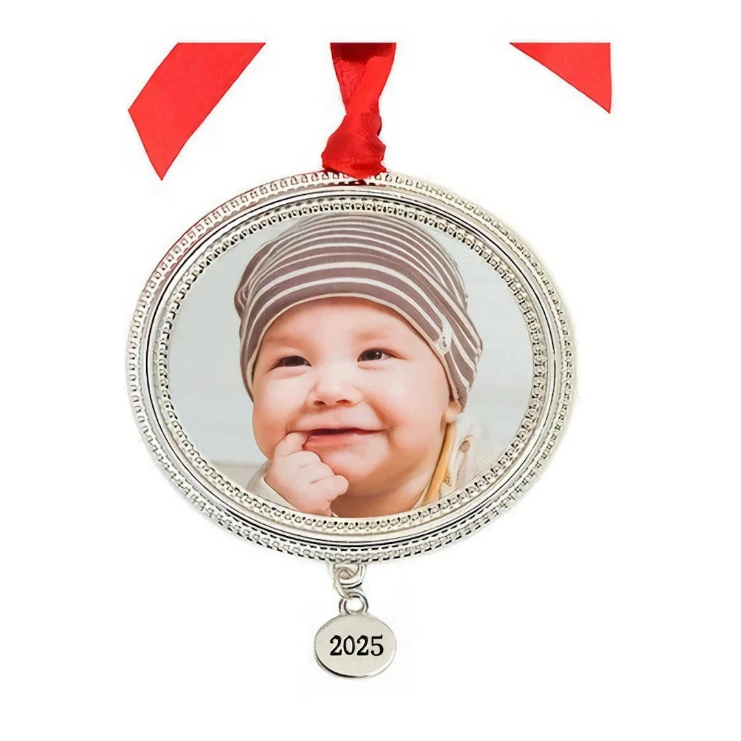 Metal Beaded Frame Photo Ornament With Year Tag: A round silver photo frame ornament with a beaded edge, a baby picture, and a year tag.