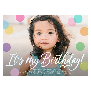 Birthday cards & invitations: A birthday invitation featuring a young girl with dark curly hair and a yellow bow, looking forward, against a blurred background with colorful polka dots, overlaid with text that reads It's my Birthday!, It's Bella's Birthday Party! 05.21.35,4:00 pm - 6:00 pm, Prestonwood Country Club, 247 Bellvue Road, Raleigh - RSVP to Jill at 914.555.2456 by May 1st.