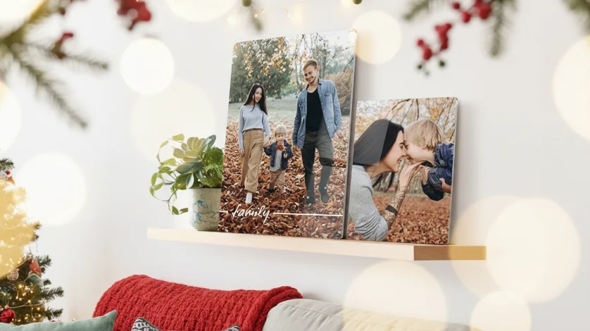 Metal Prints Christmas: Two metal prints with family photos displayed on a wooden shelf in a festively decorated room with Christmas lights.