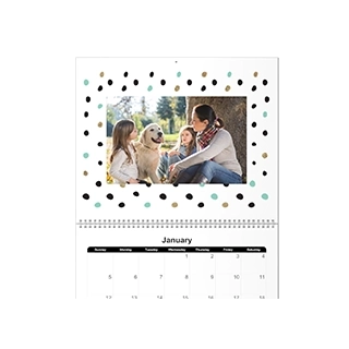 Wall Calendars: The top page of a personalized wall calendar featuring a family photo framed by a colorful polka dot border.