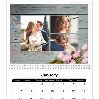 8x11 Wall Calendars: The January page of a spiral-bound wall calendar with a wedding photo collage on a blue wood-texture background.